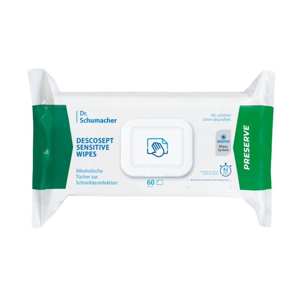 Dr. Schumacher GmbH:n Dr. Schumacher Descosept Sensitive Wipes -desinfiointipyyhkeiden pakkaus nopeaa desinfiointia varten. Etiketissä mainitaan, että kyseessä ovat alkoholipohjaiset pyyhkeet, jotka sopivat erinomaisesti keskikokoisille pinnoille. Pakkaus on pääosin valkoinen, ja siinä on vihreitä yksityiskohtia; se sisältää 60 pyyhettä.