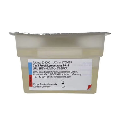 Suljettu muovinen astia, jossa on teksti "CWS ParadiseLine pesuhuonetuoksu annostelijalle Paradise Air Bar" CWS:ltä, folio kansi ja yhteystarra, on tarkoitettu vain pesuhuonetuoksujen ammattikäyttöön.