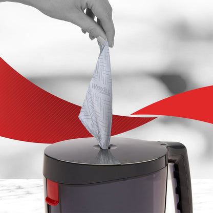 Käsi vetää WypAll® Reach™ sinistä paperipyyhettä palvelu- ja vähittäiskaupan puhdistukseen harmaan annostelijan keskitetystä jakelusta - ihanteellinen ammattilaispuhdistuspalveluille. Merkki: Kimberly-Clark GmbH, 6 rullaa à 280 liinaa.