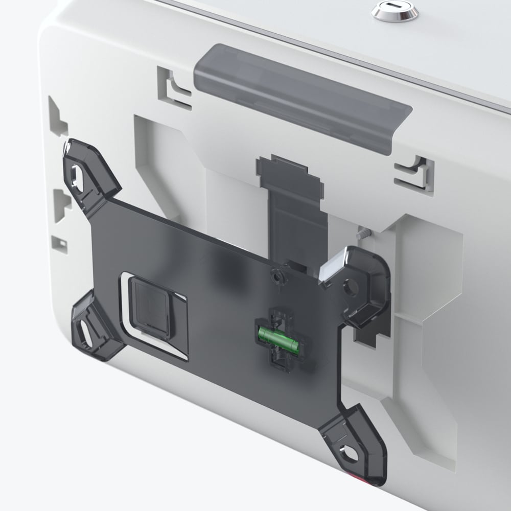 Lähikuva Kimberly-Clark Professional™ Icon™ WC-paperiannostelijan takapuolesta - Kimberly-Clark GmbH:n pienet rullat, joka näyttää mustan kiinnikkeen ja näkyvät sisäiset komponentit, mukaan lukien vihreä liitin.