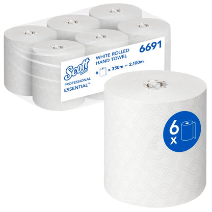 Kuvassa on laatikko, jossa on kuusi Scott® Essential™ käsipyyhettä - rulla / valkoinen (6 rullaa) Kimberly-Clark GmbH:lta, etualalla yksi rulla ja pakkauksessa tuotemerkki- ja tuoteinformaatio hygieniseen käsien puhdistukseen.
