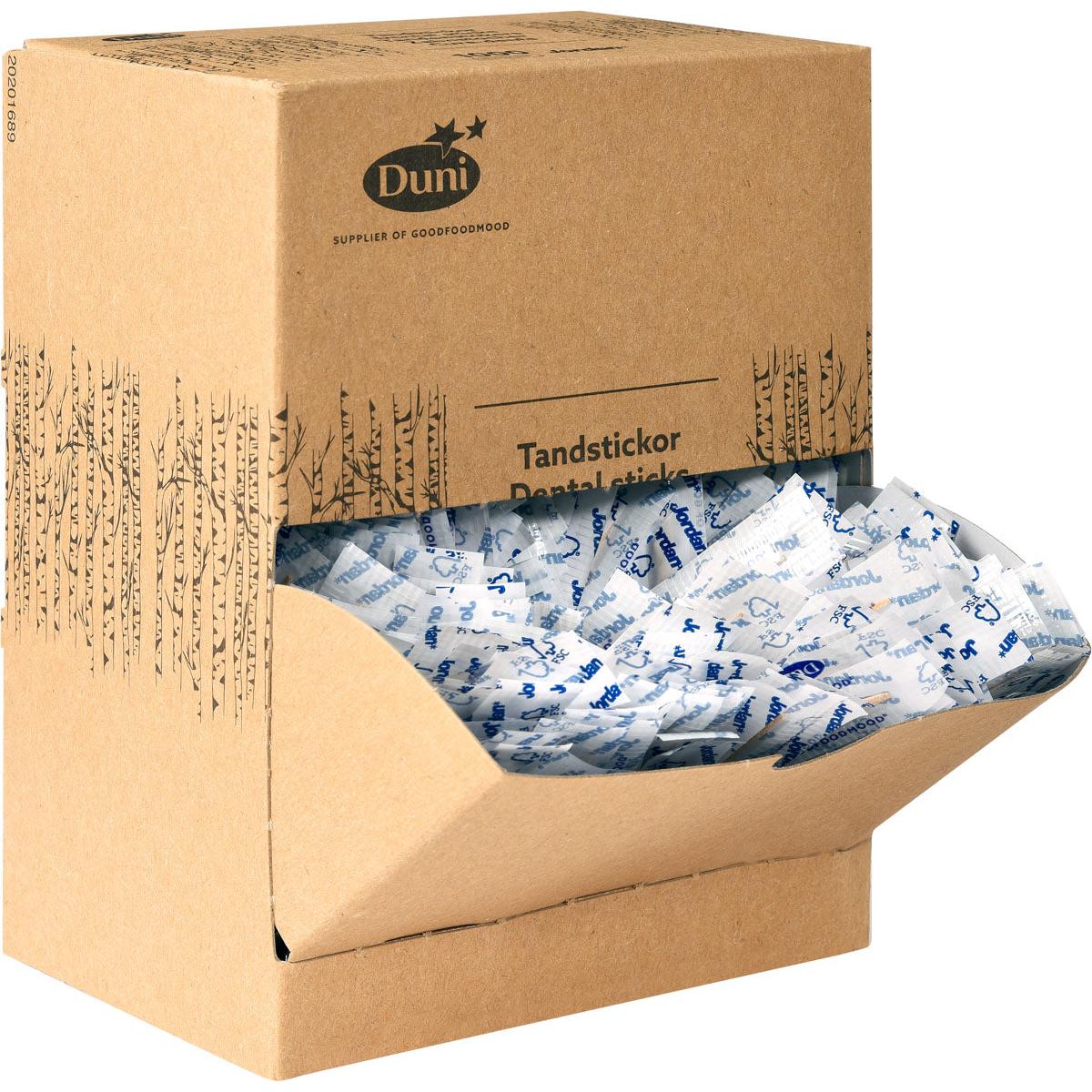 Ruskea pahvinen lahjoituslaatikko, jossa lukee "Duni GmbH Zahnstocher Neutral Holz 50 | Packung (1000 Stück)", sisältää yksittäin pakattuja puisia hammastikkuja valkoisessa ja sinisessä pakkauksessa, joista osa on näkyvissä avonaisesta etuläpistä.