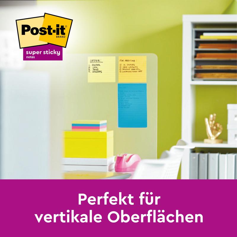 Lasinen väliseinä, jossa on keltaisia, oransseja ja sinisiä Post-it® Notes -muistilappuja suurikokoisena (101 mm x 152 mm) 3M Deutschland GmbH:lta, on kuvattu toimistossa. Saksalainen teksti kuuluu: "Täydellinen pystysuorille pinnoille." Näkyy tuotemerkki.