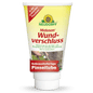 Valkoinen putkilo Neudorff Shop Malusan haavansulkijaa, haavansulkijatuote puuvartisten kasvien leikkaushaavoille, on varustettu saksankielisellä tekstillä, puunkuoren ja siveltimen kuvilla, keltaisilla ja punaisilla etiketeillä sekä yläreunassa olevalla auringonkukkalogolla.