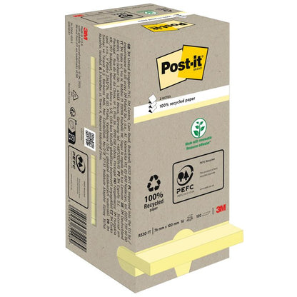 Kuvassa on 3M Deutschland GmbH:n Post-it® Recycling Z-Notes -laatikko (76x76mm, 100 arkkia, 100 % PEFC) ympäristöystävällisillä symboleilla pakkauksessa ja kaksi keltaista lohkoa, jotka ovat osittain näkyvissä pohjassa.