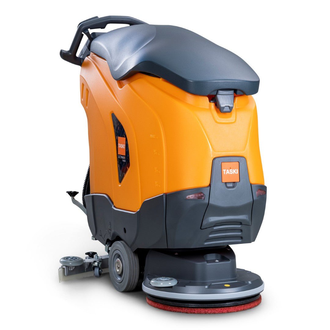 TASKI ULTIMAXX 1900 SD50 Economy Diversey Deutschlandilta on oranssi-harmaa yhdistelmäkone, jossa on 42 litran säiliö, 50 cm yksittäislevy, kahva, takapyörät ja näkyvä Taski-brändäys. Ei moottoria; ihanteellinen tehokkaaseen puhdistukseen.