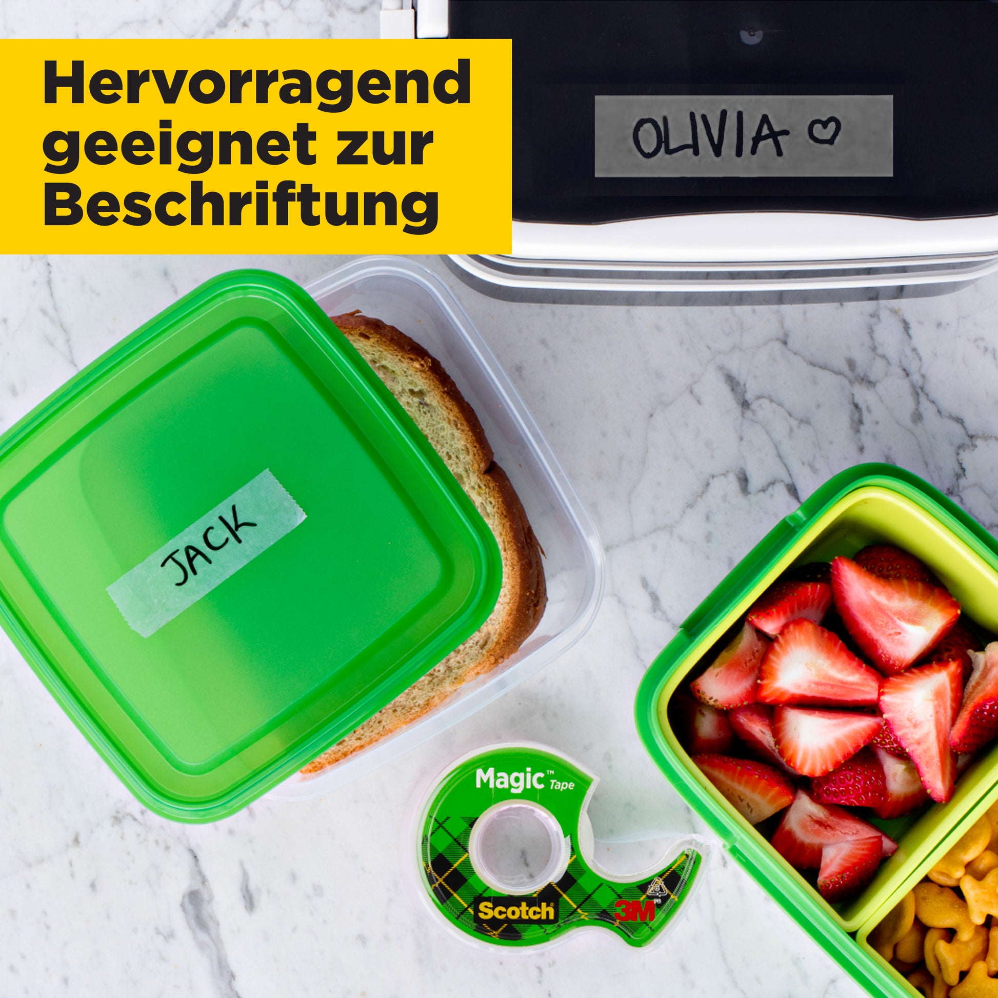 Von oben sind drei Lebensmittelbehälter zu sehen, zwei davon sind mit "JACK" und "OLIVIA" beschriftet. Daneben liegt 3M's Scotch® Magic™ Unsichtbares Klebeband (2 x 19 mm x 12 m + 3,2 m gratis) mit einem Handabroller.