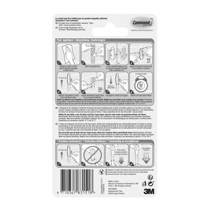 Die Rückseite des Command™ Bad Large Design-Hakens, 17083B von 3M Deutschland GmbH, zeigt eine bebilderte Schritt-für-Schritt-Anleitung zum Anbringen und Entfernen von Badezimmerhaken ohne Bohren, mit mehrsprachigem Text und Produktinformationen am unteren Rand.
