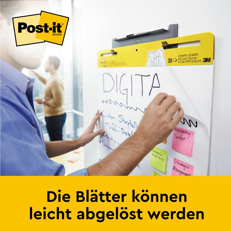 Käyttäjä kirjoittaa 3M Deutschland GmbH:n Post-it® Super Sticky itseliimautuvaan kokous-/fläppitauluun (58,4 x 50,8 cm), johon on kiinnitetty useita muistilappuja. Alapuolella lukee: "Arkit voidaan helposti irrottaa."