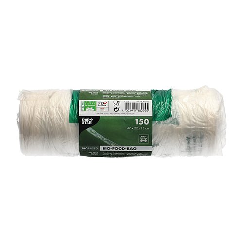 Rulla, jossa on 150 PAPSTAR solmupussia (47x22 cm) läpinäkyvästä bio-kalvosta PAPSTAR GmbH:ltä, esittelee vihreä-valkoisen banderollin tuotetietoineen ja symboleineen, ja se on kuvattu käyttämättömänä valkoisella taustalla.