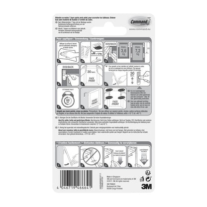 3M Deutschland GmbH:n suurten mustien Command™-kuvankiinnitysnauhojen 17206BLK pakkauksen takaosassa on kuvalliset vaiheittaiset ohjeet, painorajat ja turvallisuusvaroitukset vahingoittumattomaan ripustamiseen, teksti useilla kielillä.