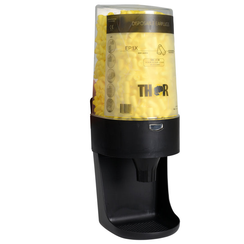 Abena Re-Seller GmbH Thor annostelija korvatulpille "One-2-Click" (813110) laatikko (3 pakkausta) on musta, läpinäkyvä annostelija, joka on tarkoitettu korvatulppien hygieeniseen säilytykseen, ja siinä on alareunassa tarjotin, josta korvatulpat on helppo ottaa.