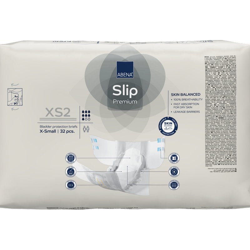 Tiivistetty ABENA Slip Premium -pakkaus Abena Re-Seller GmbH:ltä, koko X-Small, sisältää 32 slipiä. Etupuolella on tärkeimmät ominaisuudet ja kaavio, mikä tekee siitä ihanteellisen tehokkaaseen inkontinenssihuoltoon.