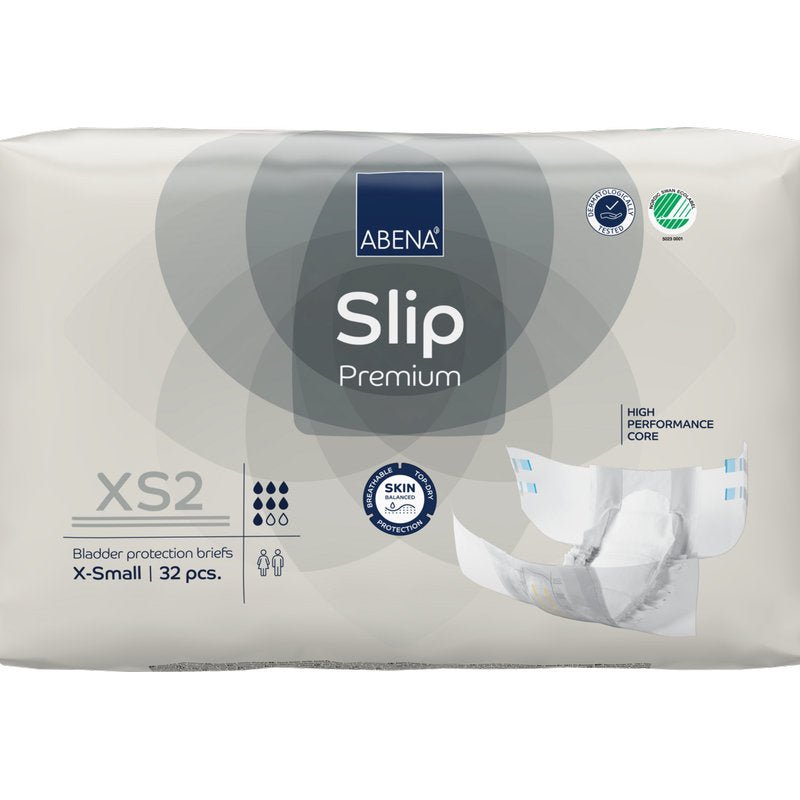 32 kappaleen ABENA Slip Premium -pakkaus Abena Re-Seller GmbH:ltä, koko XS2 X-Small, beigessä pakkauksessa, jossa on "High Performance Core" ja "Skin Friendly" sertifikaatit luotettavaan inkontinenssihuoltoon.