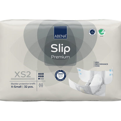 32 kappaleen ABENA Slip Premium -pakkaus Abena Re-Seller GmbH:ltä, koko XS2 X-Small, beigessä pakkauksessa, jossa on "High Performance Core" ja "Skin Friendly" sertifikaatit luotettavaan inkontinenssihuoltoon.