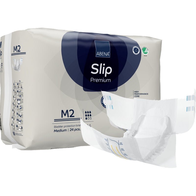 Avatun vaipan takana on ABENA Slip Premium -pakkaus Abena Re-Seller GmbH:ltä, koko M2. Pakkauksessa ilmoitetaan, että se sisältää 24 keskikokoista slipiä luotettavaan inkontinenssihuoltoon.