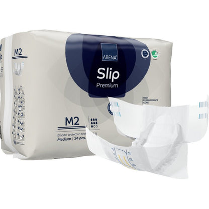 Avatun vaipan takana on ABENA Slip Premium -pakkaus Abena Re-Seller GmbH:ltä, koko M2. Pakkauksessa ilmoitetaan, että se sisältää 24 keskikokoista slipiä luotettavaan inkontinenssihuoltoon.