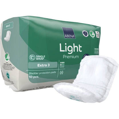 Yksi pakkaus ABENA Light Extra 3, Premium Abena Re-Seller GmbH:ltä sisältää 10 vihreä-valkoista virtsankarkailusuojaa. Etupuolella oleva tyyny esittelee turvallisen, huomaamattoman muotoilun päivittäiseen mukavuuteen.