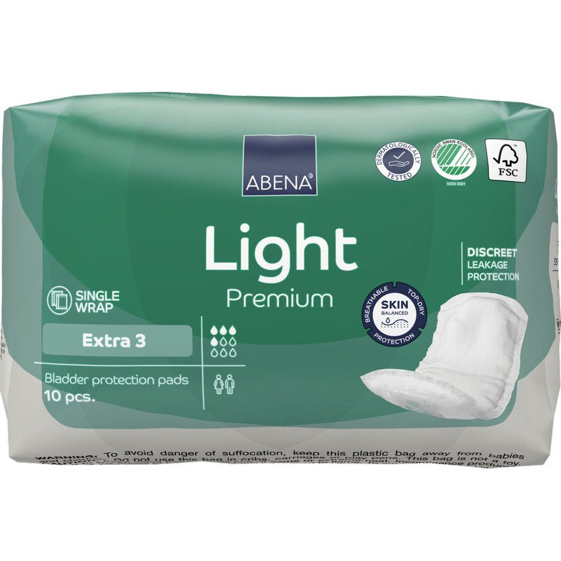 Vihreä-valkoinen pakkaus ABENA Light Extra 3, Premium Abena Re-Seller GmbH:ltä sisältää 10 kappaletta virtsankarkailusuojia. Pakkaus esittelee ominaisuudet ja kuvan suojasta oikealla puolella päivittäiseen mukavuuteen.