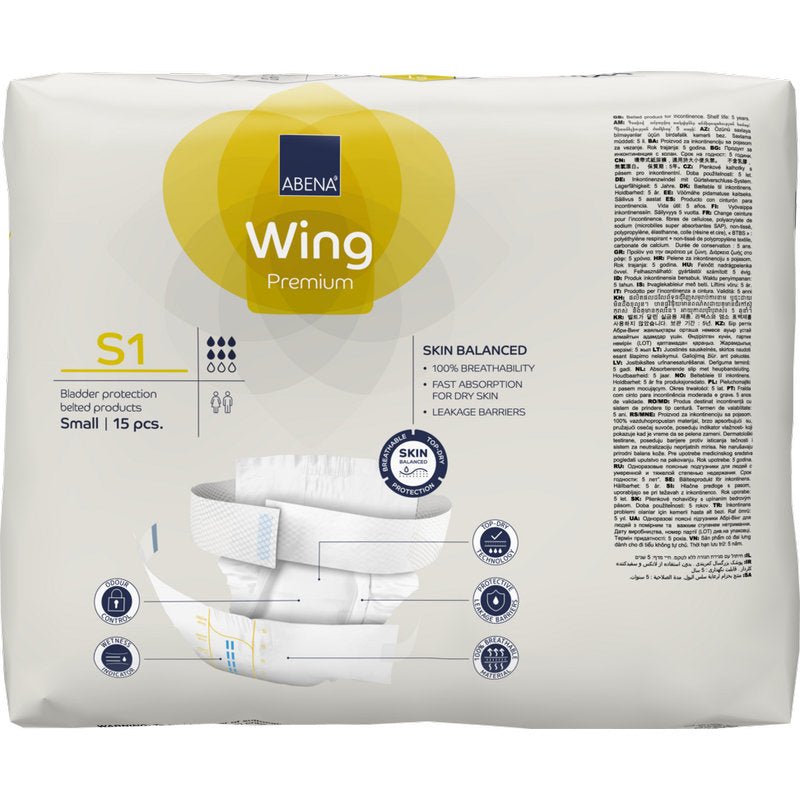 Abena Re-Seller GmbH:n ABENA Wing Premium -pakkaus, koko S1 (15 kappaletta). Valkoiset ja keltaiset pakkaukset korostavat ihon tasapainoa, nopeaa imeytymistä, luotettavia vuotosuojia suojan ja mukavuuden takaamiseksi.