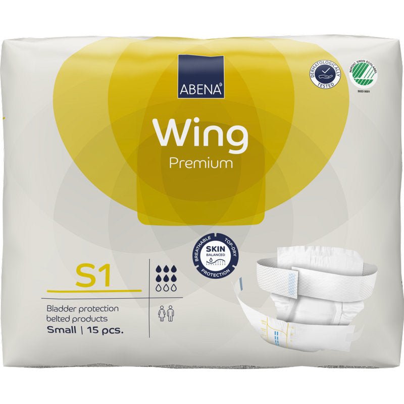 15 kappaleen pakkaus ABENA Wing Premium -vaippoja Abena Re-Seller GmbH:lta, koko Small, tulee pääosin valkoisessa pakkauksessa, jossa on keltaisia aksentteja, jotka korostavat suojaa ja mukavuutta, sekä tuotekuva etupuolella.