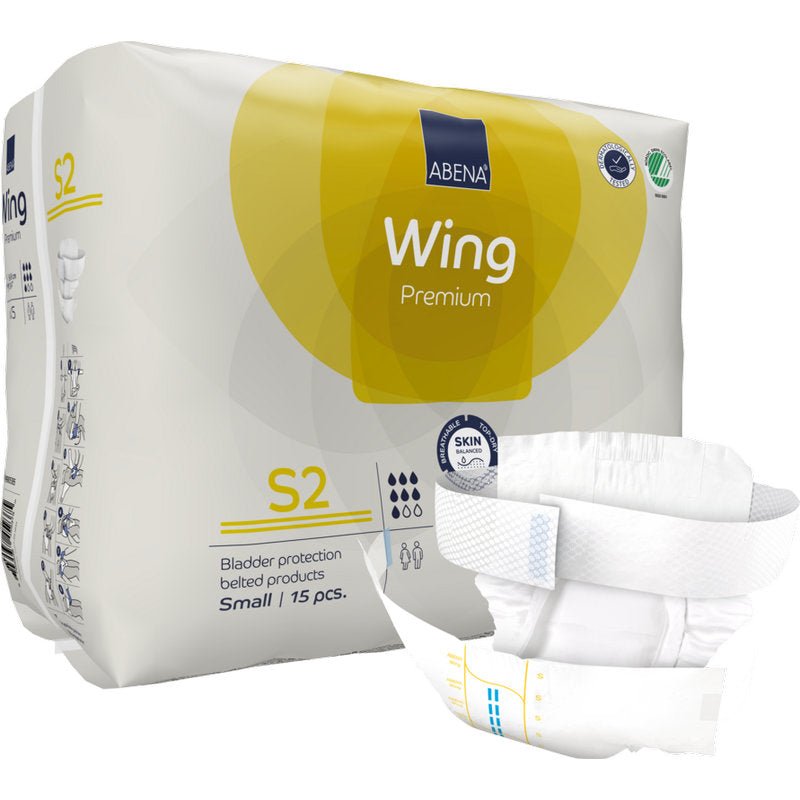 15 ABENA Wing Premium S2 vyövaippaa aikuisille Abena Re-Seller GmbH:lta. Kelta-valkoinen pakkaus näyttää tuoteinformaation, edessä avattuna olevan vaipan ja korostaa suojaa ja mukavuutta vakiintuneina inkontinenssituotteina.