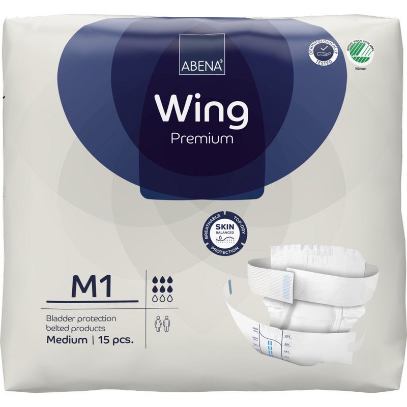 15-osainen pakkaus ABENA Wing Premium -inkontinenssivaippoja, joissa on vyö, medium, Abena Re-Seller GmbH:lta. Valkoinen pakkaus, jossa on tummansinisiä aksentteja, näyttää tuotemerkit ja kuvan vaipasta optimaalisen suojan ja mukavuuden takaamiseksi.