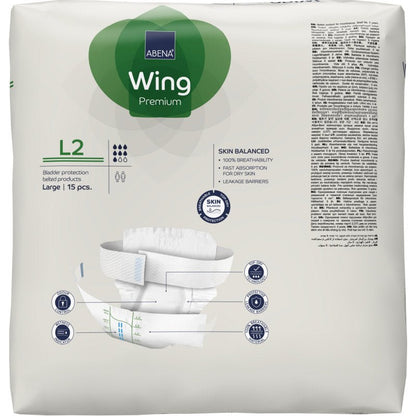 15 kappaleen pakkaus ABENA Wing Premium virtsarakonsuojatyynyjä, suuri koko, Abena Re-Seller GmbH:ltä. Valkoinen pakkaus vihreillä ja sinisillä korostuksilla esittää etupuolella kuvan tyynystä mukavuuden ja suojan vuoksi.