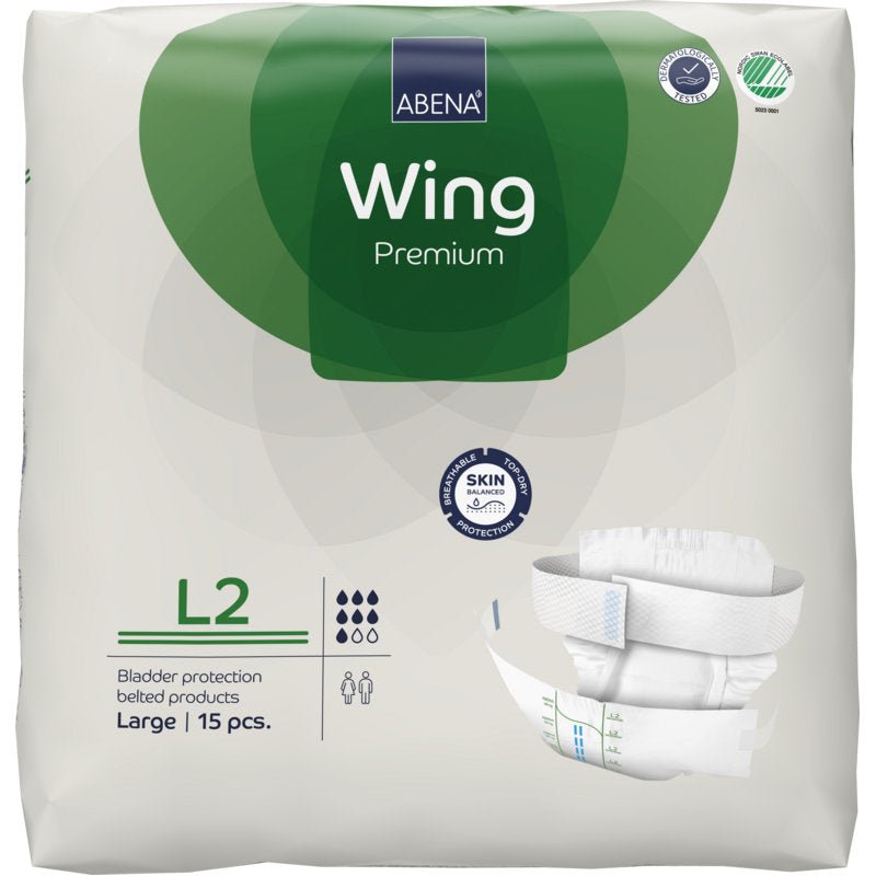 Pakkaus ABENA Wing Premium Abena Re-Seller GmbH:ltä, koko Large, 15 kappaletta. Valko-vihreä pakkaus esittelee tuotetietoja, vaippakuvan ja korostaa "suojaa ja mukavuutta" luotettavalle virtsarakonsuojalle.