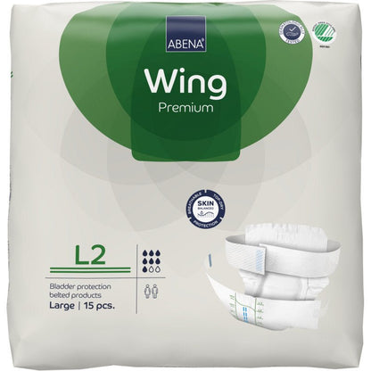 Pakkaus ABENA Wing Premium Abena Re-Seller GmbH:ltä, koko Large, 15 kappaletta. Valko-vihreä pakkaus esittelee tuotetietoja, vaippakuvan ja korostaa "suojaa ja mukavuutta" luotettavalle virtsarakonsuojalle.