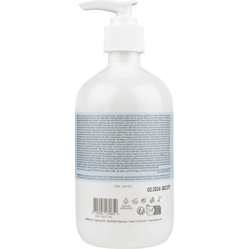 Läpinäkyvä muovipullo, jossa on valkoinen pumppupää ja merkintä "Mieto hajusteeton voide saippua" Abena Re-Seller GmbH:lta, on varustettu suurella sinivalkoisella etiketillä ja monikielisillä tuoteinformaatiolla takana.