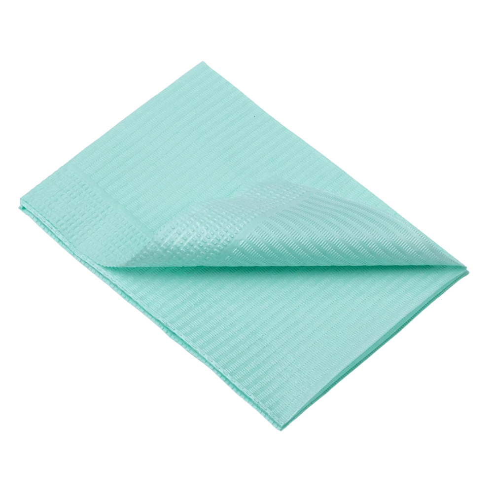 Taiteltu, vaaleansininen AMPri Dental kertakäyttöinen potilasliina, jossa on kuvioitu pinta, makaa tasaisesti valkoisella taustalla. Reunat ovat siististi kohdistettu ja yksi kulma on käännetty, jolloin molemmat puolet ovat näkyvissä.