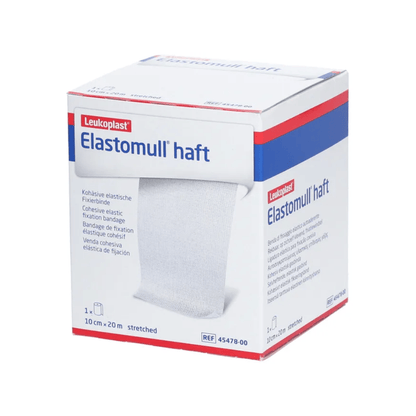 Laatikko BSN Elastomull® haft, BSN Medical GmbH:n joustava kiinnitysside. Laatikko on pääosin valkoinen sinisillä ja punaisilla yksityiskohdilla ja esittelee etupuolella tuotetiedot ja eritelmät.
