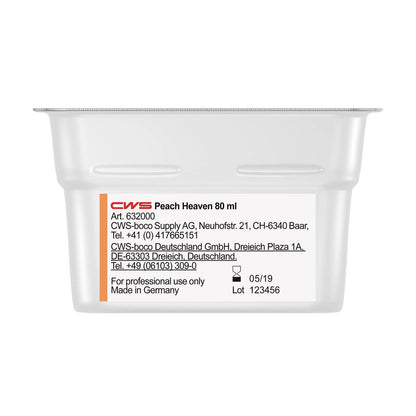 Lähikuva valkoisesta CWS ParadiseLine pesuhuonetuoksuastiasta annostelijalle Paradise Air Bar, jossa on tuotetiedot, yritystiedot, "Made in Germany" ja läpinäkyvä kansi. Sopii pesuhuoneiden tuoksujärjestelmiin.