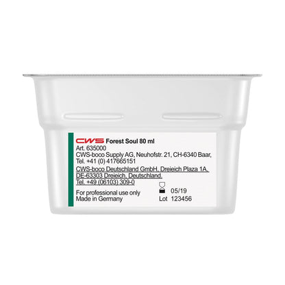 Suorakulmainen valkoinen astia, jossa on teksti "CWS ParadiseLine pesuhuonetuoksu annostelijalle Paradise Air Bar" CWS:ltä, näyttää valkoisessa etiketissä tuote- ja yritystiedot, yhteystiedot, valmistuspäivämäärän (05/19) ja eränumeron (123456).