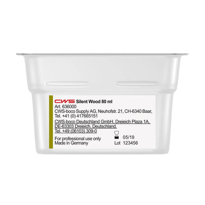 Lähikuva CWS ParadiseLine pesuhuonetuoksu annostelijalle Paradise Air Bar-astiasta, jossa on valmistajatiedot, yhteystiedot, eränumero ja viimeinen käyttöpäivä etiketissä. Vain ammattikäyttöön.