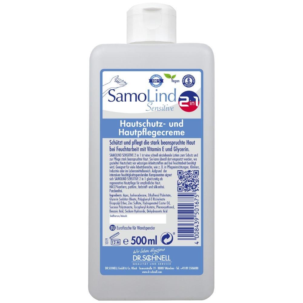 500 ml:n pullo SamoLind Sensitive 2in1 ihonsuoja- ja hoitovoide DR.SCHNELL GmbH & Co. KGaA:lta, saksankielisellä tekstillä, sinivalkoisella etiketillä, vegaanisten ja herkän ihon symbolien kera sekä glyseriinillä rikastettuna lisähoitoa varten.