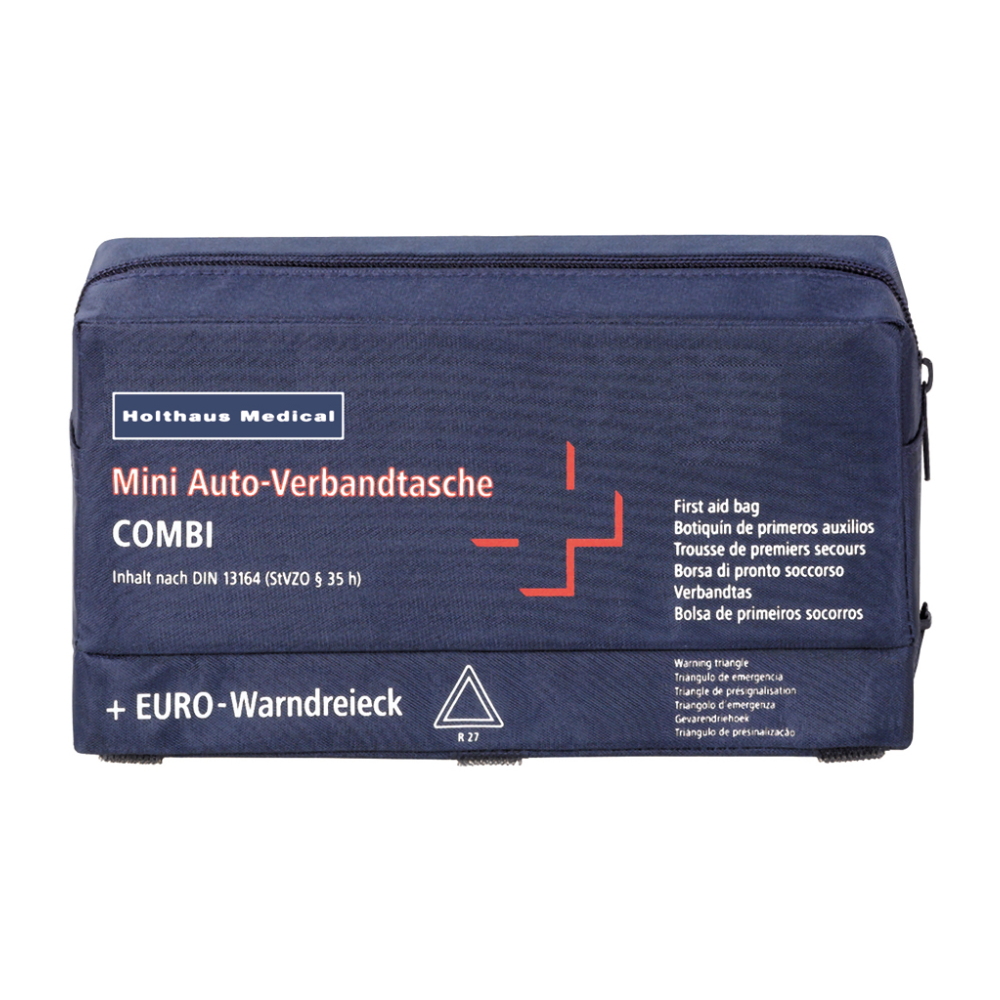 Tummansininen ensiapulaukku, jossa on teksti „Holthaus Mini Combi Auto-Verbandtasche“ Holthaus Medical GmbH & Co. KG:ltä, valkoisella ristillä ja punaisilla yksityiskohdilla. Teksti sisältää useita käännöksiä „ensiapulaukusta“ ja mainitsee, että sisältö vastaa standardia DIN 13164.