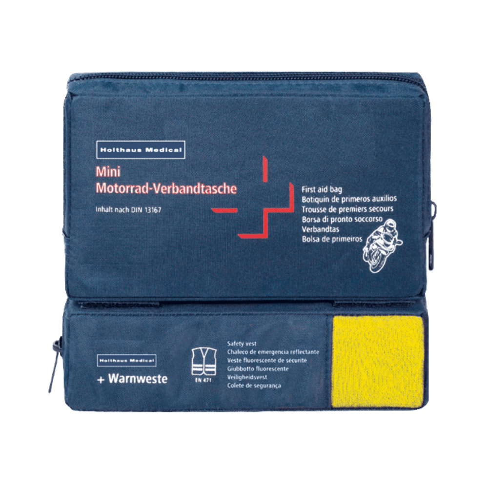 Sininen ensiapupakkaus, jossa on teksti „Holthaus Mini Combi Verbandtasche Motorrad“ Holthaus Medical GmbH & Co. KG:ltä monikielisellä tekstillä moottoripyöriä varten. Se vastaa DIN 13167 -standardia ja sisältää läpinäkyvän osan kautta näkyvän turvaliivin. Mini Combi Verbandtasche -pakkauksessa on kaksi vetoketjullista lokeroa – yksi ylhäällä ja yksi sivulla.