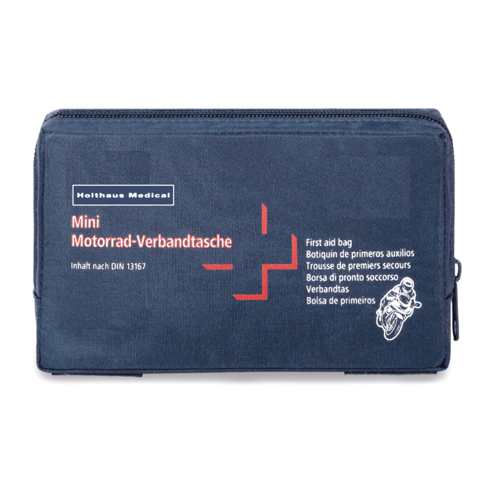 Tummansininen ensiapulaukku, jossa on valkoinen ja punainen teksti „Holthaus Mini Motorrad Verbandtasche DIN 13 16“. Laukussa on myös pieni moottoripyöräkuva ja se sisältää monikielisiä etikettejä, jotka osoittavat, että kyseessä on Holthaus Medical GmbH & Co. KG:n valmistama ensiapuväline DIN 13167 mukaisesti.