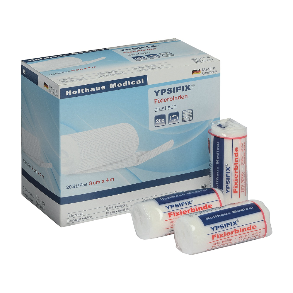 Kuva Holthaus Medical GmbH & Co. KG:n Holthaus Ypsifix® -kiinnityssidelaatikosta, 8 cm x 4 m. Laatikko sisältää 20 yksittäistä sidettä. Laatikon edessä on kuvattuna kolme yksittäistä sidettä; kaksi on pakattu muoviin, kun taas yksi on osittain purettu. Valmistettu Saksassa, täydellinen haavapeitteiden kiinnittämiseen.