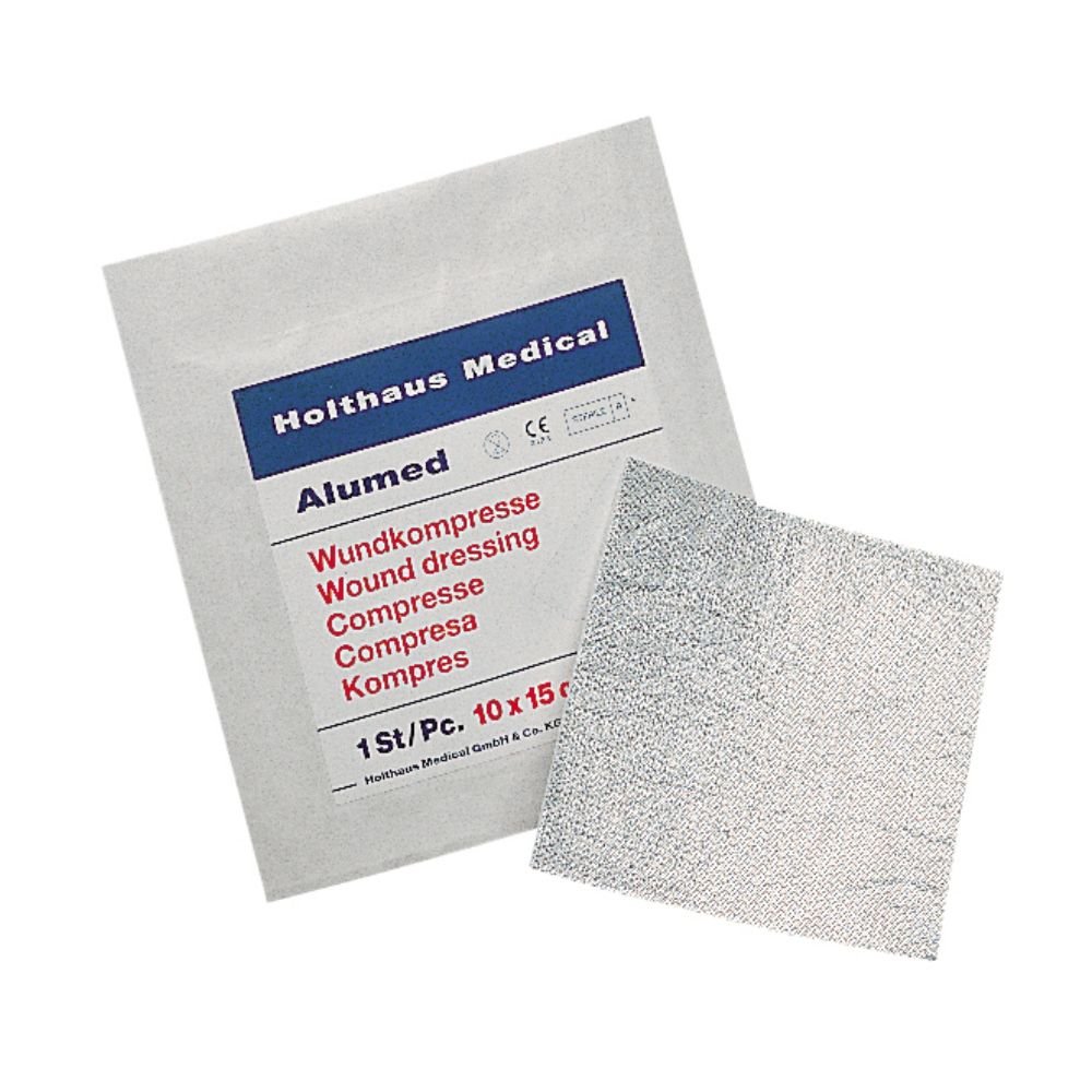 Holthaus Medical Alumed® Wundkompresse -paketti Holthaus Medical GmbH & Co. KG:ltä näyttää useilla kielillä haavasidoksen alumiiniverkolla. Se on kooltaan 10 x 10 cm ja sisältää yhden steriilin kappaleen (1 kappale).
