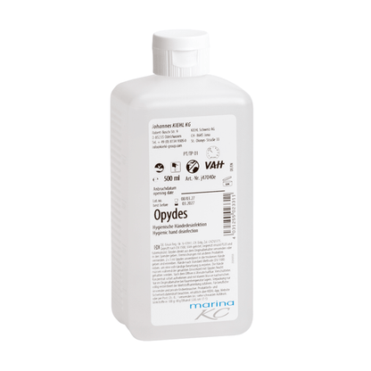 Valkoinen 500 ml muovipullo Kiehl Opydes Hygienische Händedesinfektion Johannes Kiehl KG:ltä valkoisella korkilla ja etiketillä, jossa on käyttöohjeet, annostusohjeet, valmistajatiedot ja sertifiointilogot.