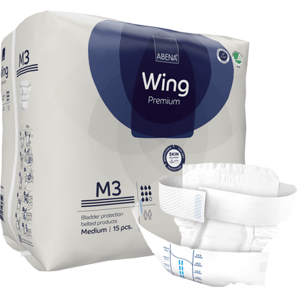 Abena Re-Seller GmbH:n ABENA Wing Premium aikuisten vaippapakkaus, koko M3, sisältää 15 kappaletta. Edessä on kuva vaipasta, joka korostaa sen muotoilua ja läppiä optimaalisen suojan ja mukavuuden takaamiseksi. Pakkaus näyttää tuote- ja tuotemerkkitiedot.