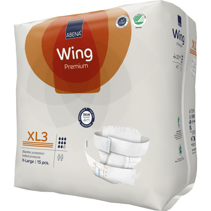 Pakkaus ABENA Wing Premium -aikuisten vaippoja Abena Re-Seller GmbH:lta (15 kappaletta) on pääosin valkoinen pakkaus, jossa on oransseja ja ruskeita korostuksia, tarjoaa parhaan suojan ja yksityiskohtaiset kokotiedot.