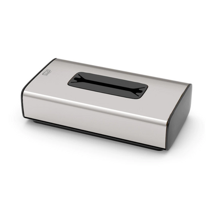 Tork 460013 -kosmetiikkaliina-annostelija TORK:in Image Line F1 -kokoelmasta, Essity Professional Hygiene Germany GmbH, on ruostumattomasta teräksestä valmistettu nenäliinaboksi, jonka yläosassa on suorakulmainen aukko. Se esittelee ruostumattoman teräksen muotoilua, mustaksi maalattuja reunoja ja minimalistista tyyliä, joka sopii erinomaisesti yksittäislehtien annosteluun.