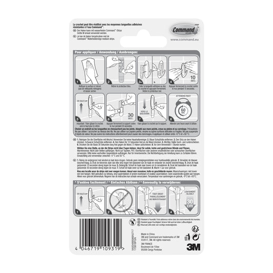 Die Rückseite einer Command™ Bad Medium Designer-Haken, 17081B (1 Stück) Packung der 3M Deutschland GmbH zeigt illustrierte Anwendungs-/Entfernungsschritte, mehrsprachigen Text, Barcode unten links und sichtbare 3M- und Command-Logos.