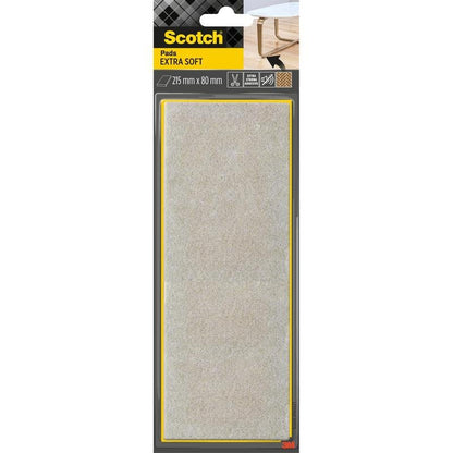Kuvassa on pakkaus Scotch® Extra pehmeitä huopatyynyjä, itseliimautuvia, beige (215 mm x 80 mm) 3M Deutschland GmbH:lta musta-keltaisessa alkuperäispakkauksessa, jossa on pöydänjalka, jonka oikeassa yläkulmassa on tyyny.