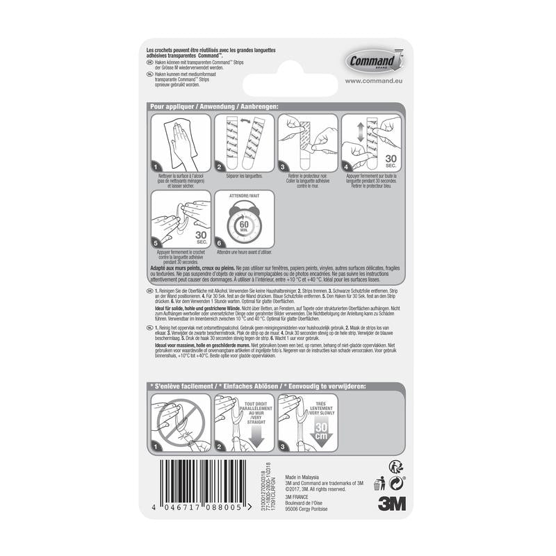 Command™ Koukku M, keskikokoinen, läpinäkyvä läpinäkyvillä nauhoilla (17091CLR) 3M Deutschland GmbH:sta sisältää pakkauksen takapuolen, jossa on monikielinen kuvallinen ohje, varoitukset ja 3M logo oikeassa alakulmassa.